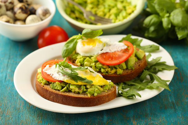 Sandwiches with egg, avocado and vegetables - Fotó, kép