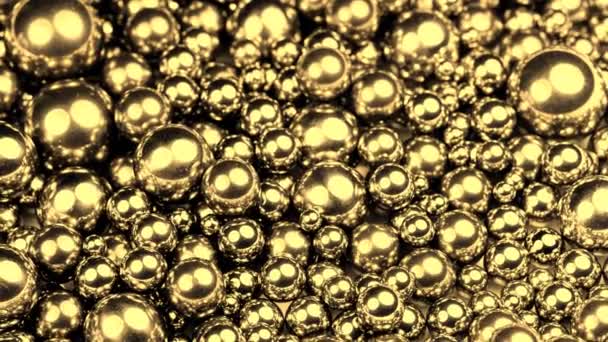 golden steel balls turning on a rotary table, closeup - Séquence, vidéo
