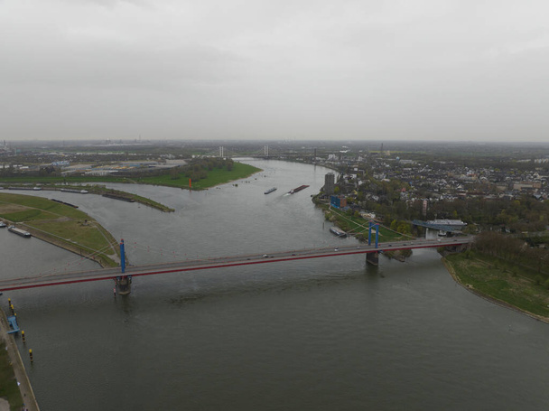 The Friedrich-Ebert-Brucke is a cable-stayed bridge for road traffic over the Rhine near the German city of Duisburg. Aerial drone view. - Fotó, kép