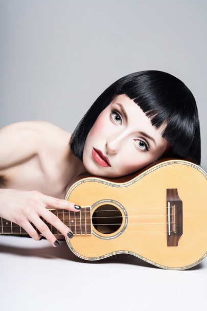 Beauty girl with little guitar - Fotó, kép