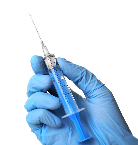 Hand in gloves with syringe isolated on white - Foto, Bild