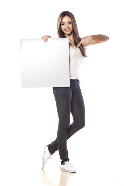 Pretty girl holding a blank board - Фото, зображення