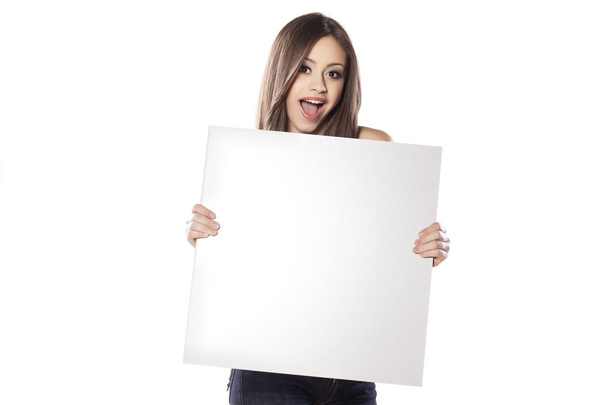 Pretty girl holding an empty board - Photo, Image