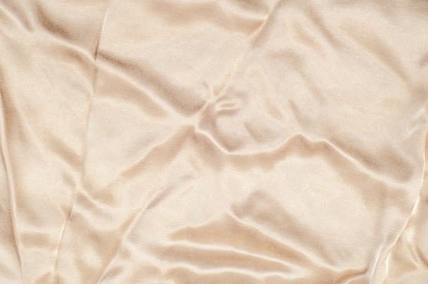 Stoff Seide Textur, braun. eine feine, starke, weiche, glänzende Faser, die von Seidenraupen zur Herstellung von Kokons hergestellt und gesammelt wird, um Garne und Gewebe herzustellen - Foto, Bild
