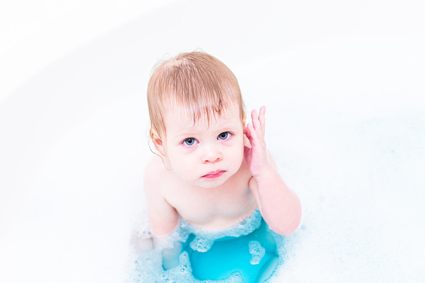 Baby girl having a bath - Photo, Image