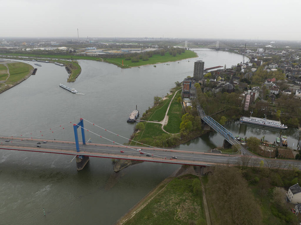 The Friedrich-Ebert-Brucke is a cable-stayed bridge for road traffic over the Rhine near the German city of Duisburg. Aerial drone view. - Φωτογραφία, εικόνα