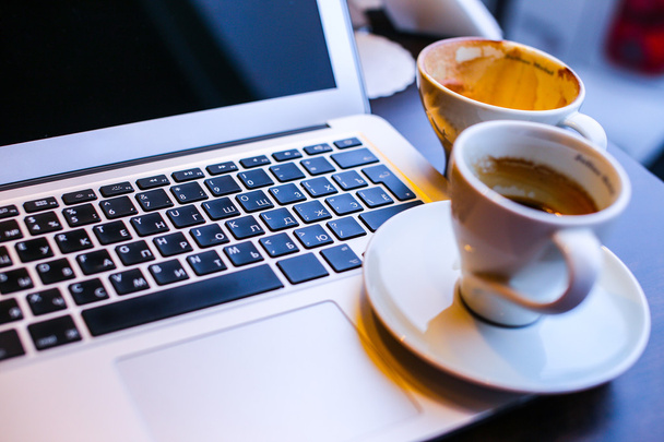 Laptop and cup of coffe - Photo, Image
