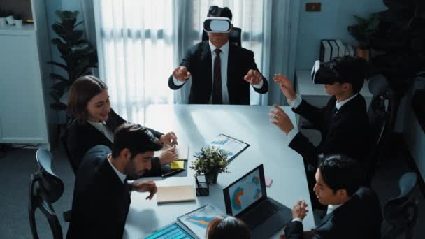 Top view of manager working on laptop and sending data analysis to business people by using VR glass headset while diverse team planning marketing strategy and looking at financial graph. Directorate. - Footage, Video