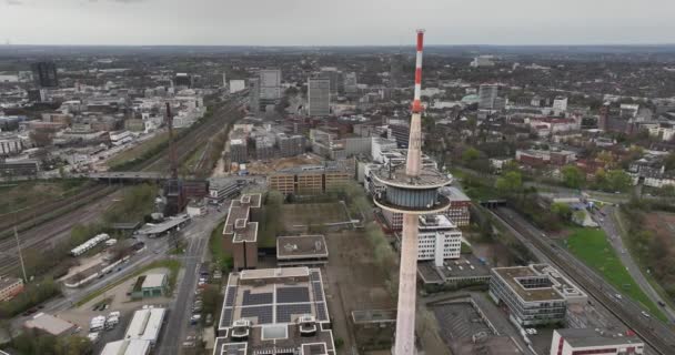 Aerial overview of the telecommunications tower, railway station and suviertel in Essen, Germany, North Rhine-Westphalia - Video