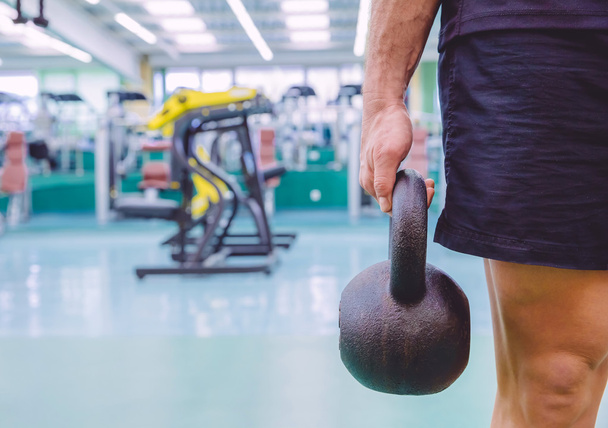 Man holding kettlebell in a crossfit training - Foto, immagini