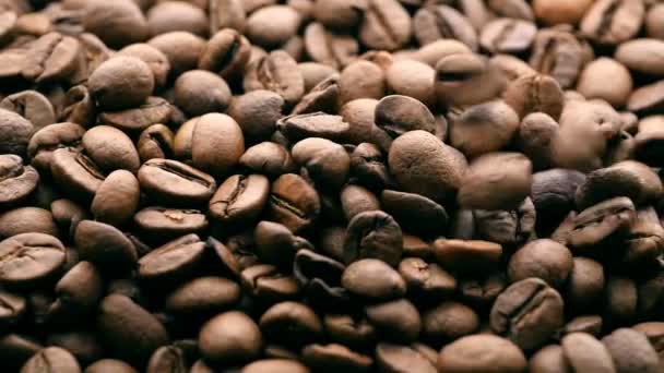 Falling coffee beans background. Sliding camera - Footage, Video