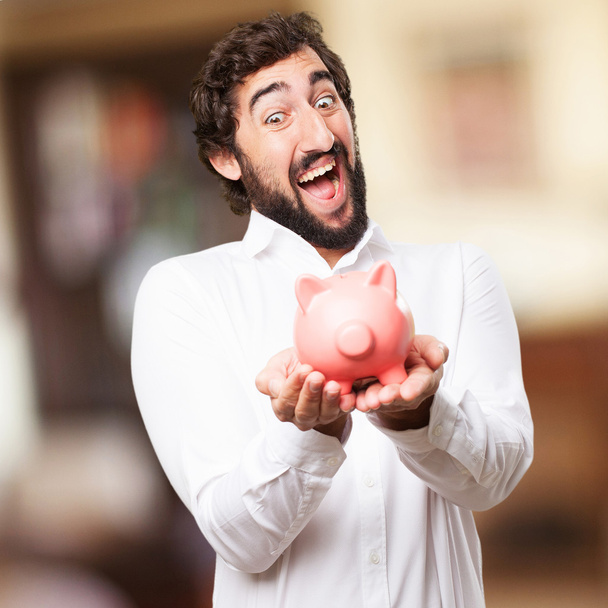 man with a piggy bank - Zdjęcie, obraz
