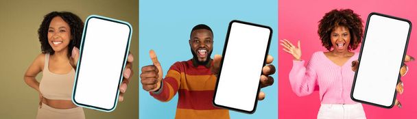 A gathering of black people standing together in a group, holding up a phone with a blank screen. They seem engaged and focused on the device, mobile app concept - Photo, Image