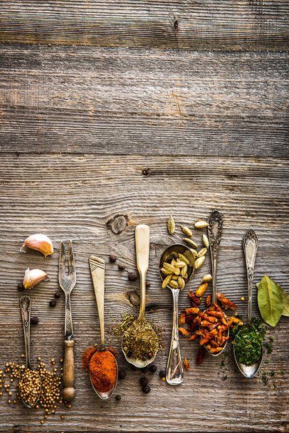 spices in the spoons on a table - Fotoğraf, Görsel