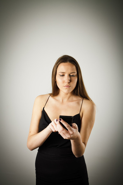 Young woman with telephone - Фото, зображення
