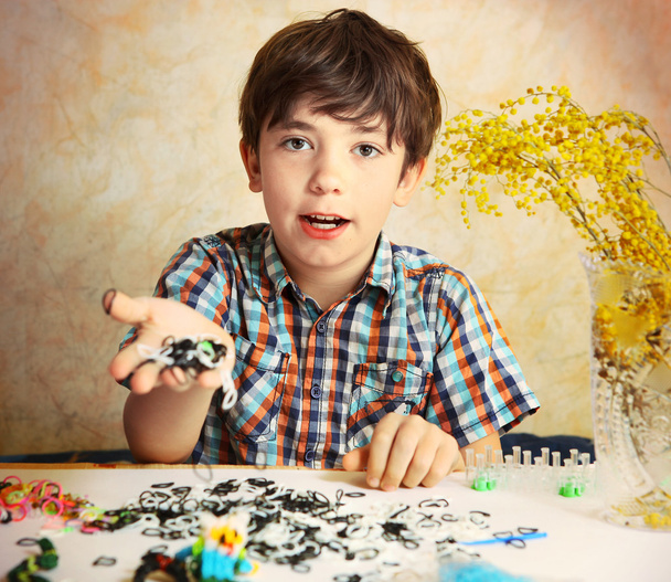 preteen hansome boy show  the result of his rainbow loom hobby p - Photo, Image