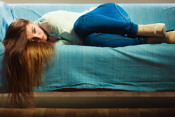 Sad woman laying on couch - Foto, Imagem
