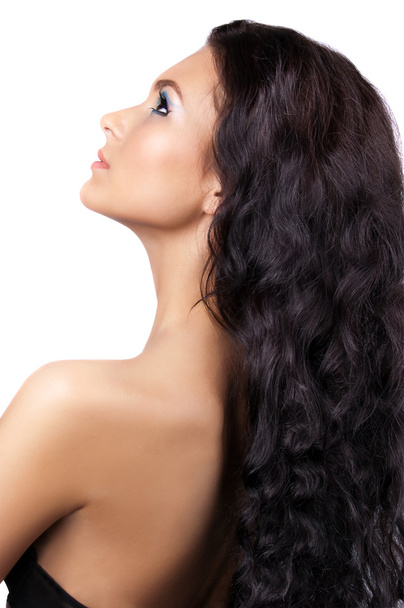 Young woman with long curly hair - Φωτογραφία, εικόνα
