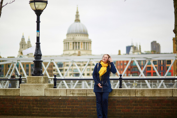 Tourist in London on the Thames embankment  - Фото, зображення