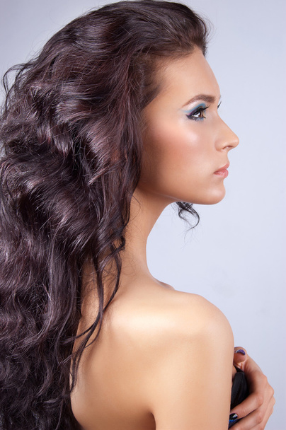 Young woman with long curly hair - Foto, Imagem