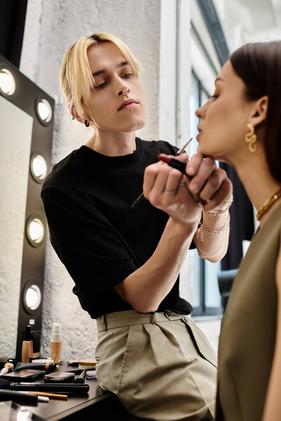 Woman receiving makeup application in front of mirror. - Photo, Image