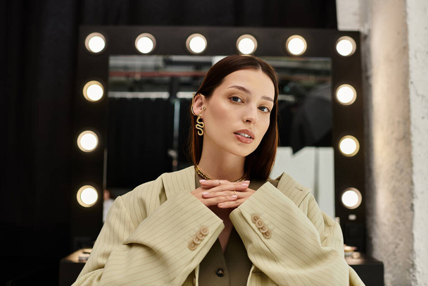 Woman admiring makeup next to mirror. - Photo, Image
