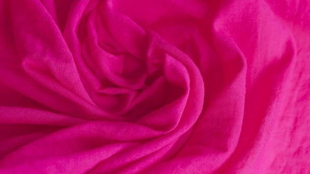 rich pink fuchsia fabric, luxurious and vibrant, ideal for design and fashion projects... - Photo, Image