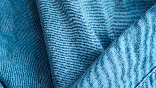 Tessuto blu jeans con trama dettagliata, perfetto per la moda e la grafica di design tessile - Foto, immagini