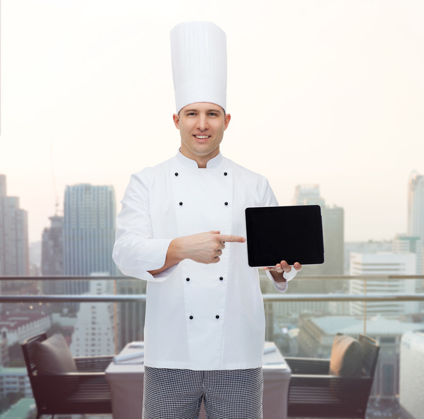 happy male chef cook showing with tablet pc - Fotó, kép