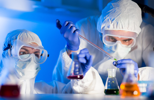 close up of scientists making test in lab - Φωτογραφία, εικόνα