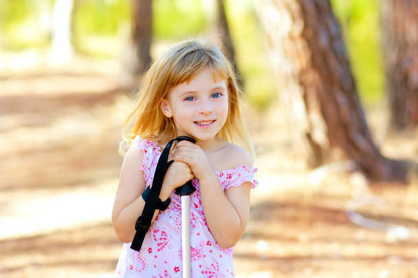 Beautiful kid girl in park forest smiling - Фото, изображение