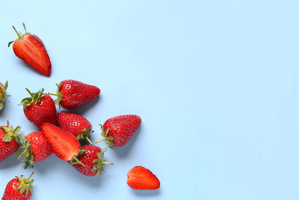 Sweet fresh strawberries on blue background - Photo, Image