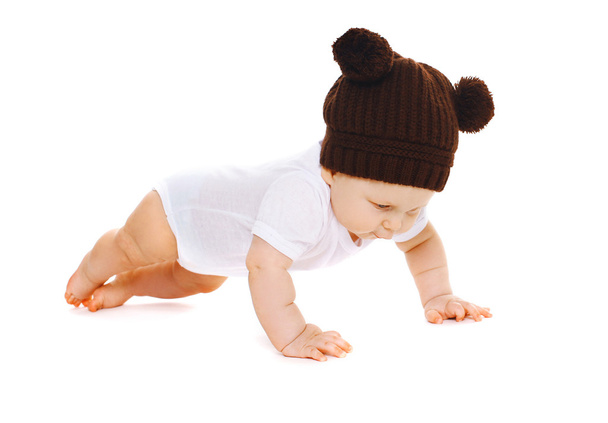 Funny little baby in the knitted brown hat  - Zdjęcie, obraz