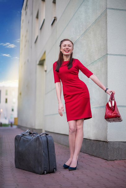 Girl with gray vintage valise - 写真・画像