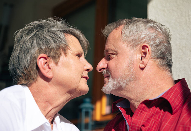 Close-up of a senior couple gazing into each other's eyes with affection - Photo, Image