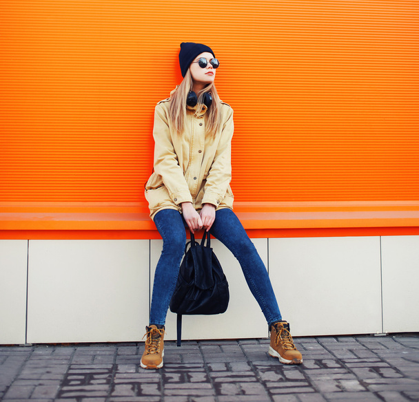 Outdoor fashion portrait of stylish hipster cool girl wearing a  - Фото, зображення