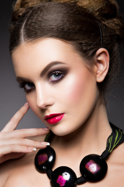 Close-up portrait of beautiful woman with bright make-up - 写真・画像