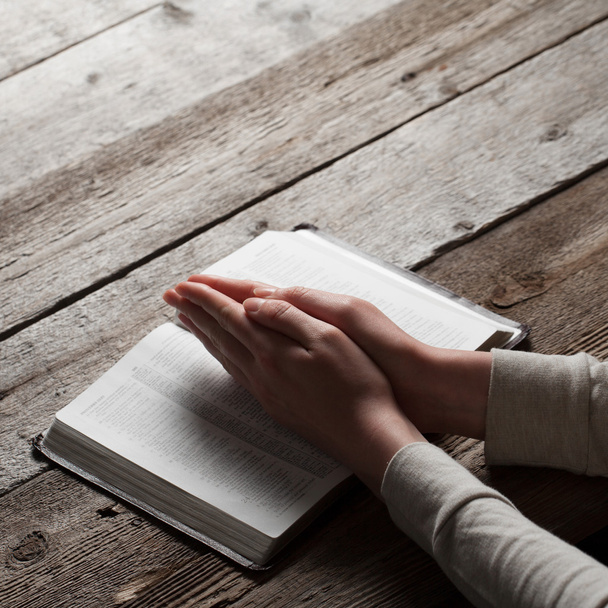 Woman hands praying with a bible - Fotó, kép