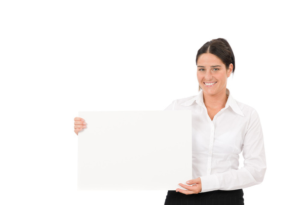 Happy businesswoman holding aside empty banner - Photo, Image