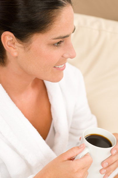 Attractive woman in white bathrobe with coffee - Фото, зображення