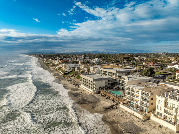 Aerial view of Carlsbad promenade, oceanside villas, holiday rentals with cloudy sky - Photo, Image