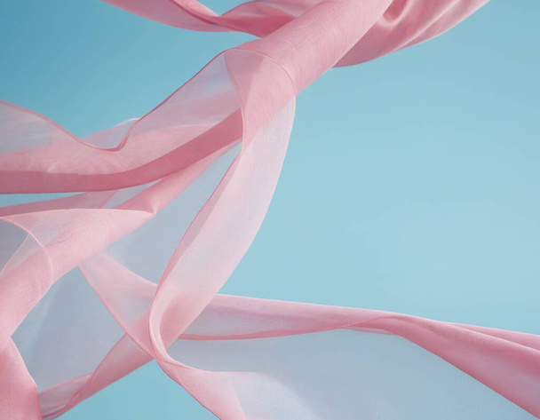Onde de tissu rose volant isolée sur fond bleu, ondulation fluide tissu flottant de soie - Photo, image