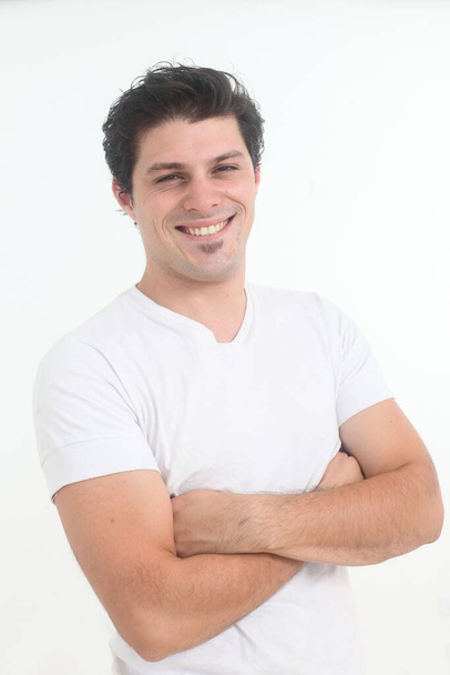 handsome cheerful young man in white t shirt on white background - Photo, Image