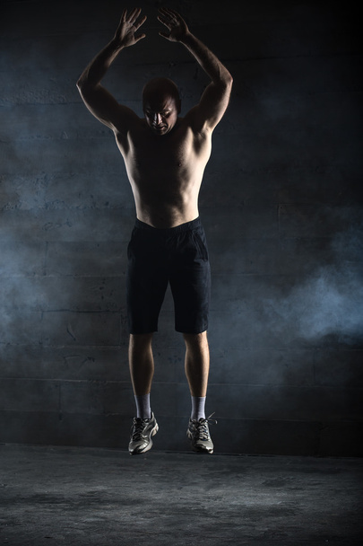 Bald athlete topless jumping up - Valokuva, kuva
