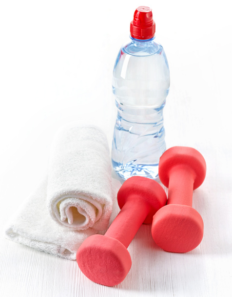 Fitness equipment dumbbells, towel and bottle of water - Foto, Bild
