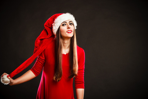 Attractive woman in christmas hat. - Zdjęcie, obraz
