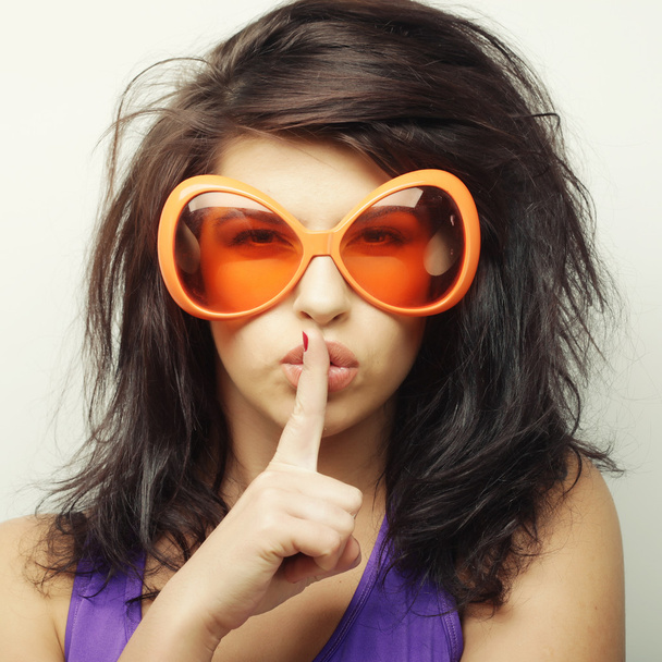 young woman with big orange sunglasses - Фото, изображение