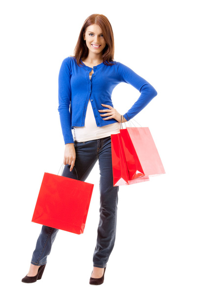 Young happy woman with shopping bags, isolated on white - Photo, image