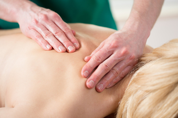 Stressed woman having back massage - Foto, immagini