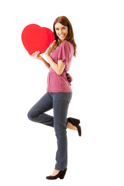 Young happy smiling woman with heart symbol, isolated - Foto, Bild